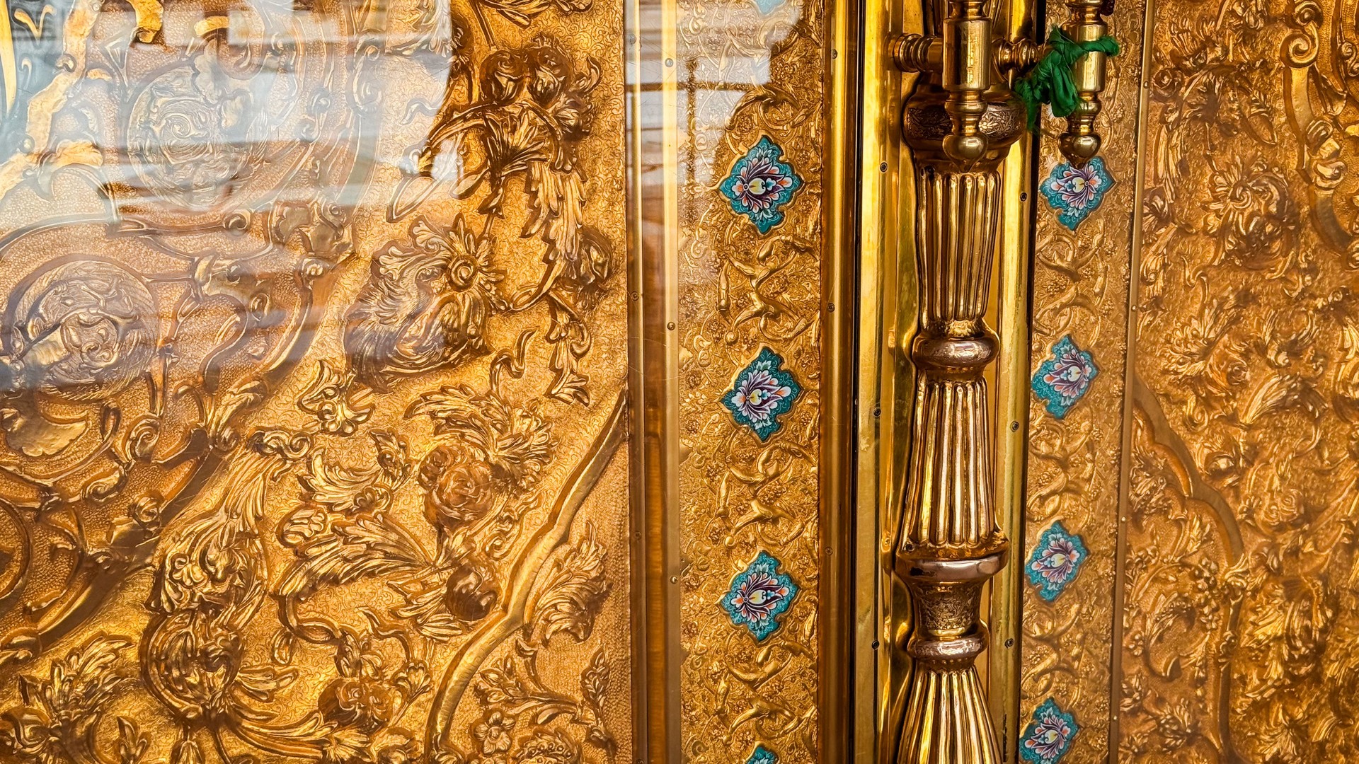 Intricate golden decor at a shrine entrance in Kufa, Iraq